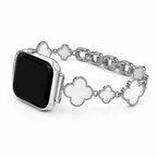 Close up detail of shell four-leaf clover charms on Apple Watch bracelet