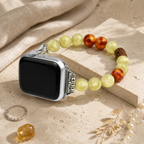 Boho green beaded Apple Watch bracelet band styled with jewelry on a neutral background