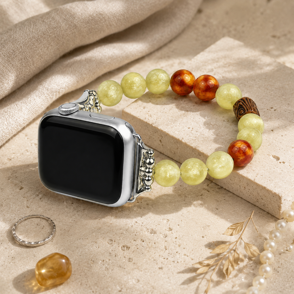 Boho green beaded Apple Watch bracelet band styled with jewelry on a neutral background
