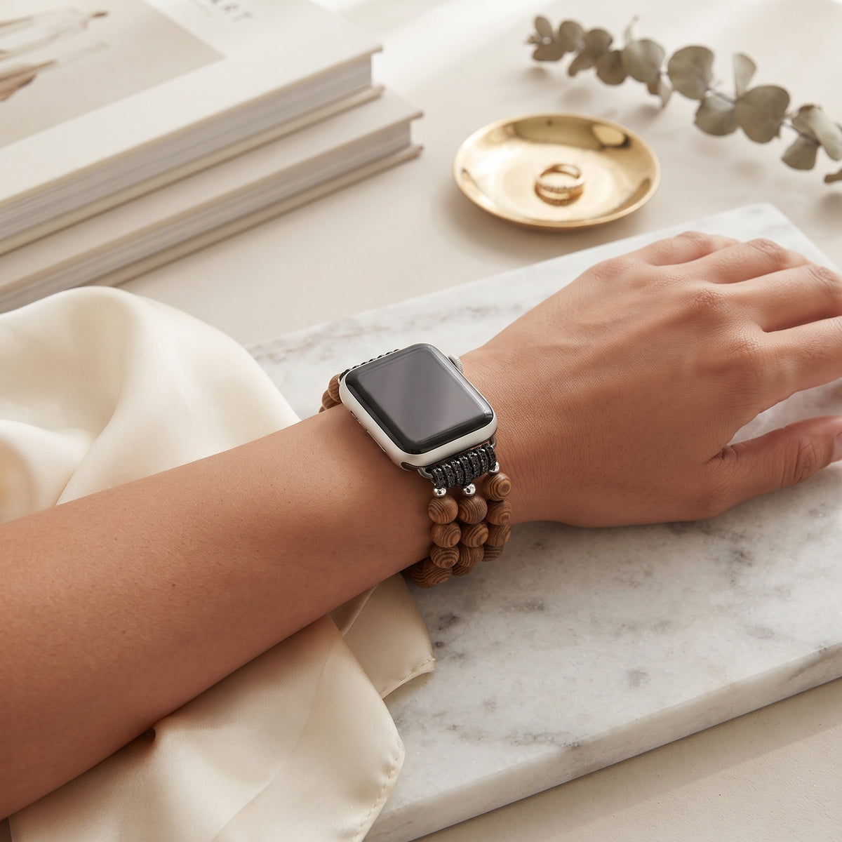 Natural Wood Beaded Apple Watch band worn on the wrist